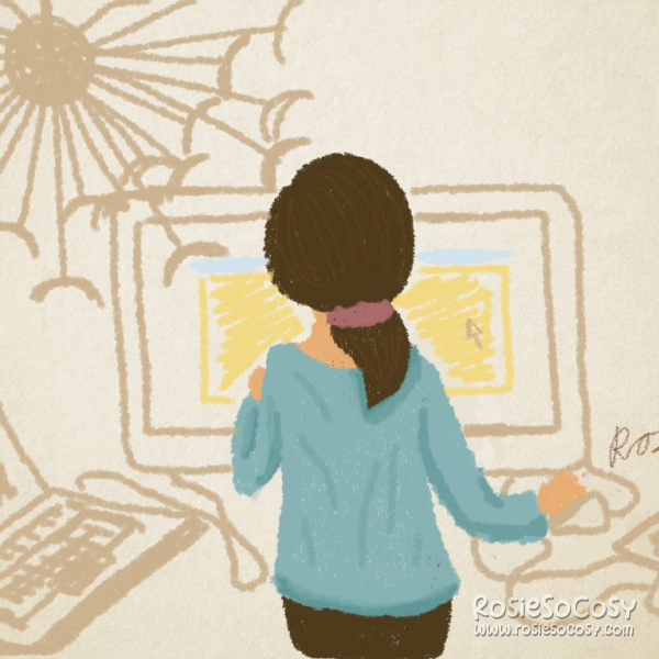 A light to medium coloured woman with brown hair in a low ponytail is standing facing away from the camera. She is wearing a blue sweater and dark brown jeans. The focal point is on the woman. She is at work on her iMac. She is designing a website, which has some pastel yellow and pastel blue in it. Everything in the background is beige. On the left of her is a laptop, which seems to be connected to the iMac. On her right is a drawing tablet. On the left above her is a MASKROS ceiling lamp from IKEA.