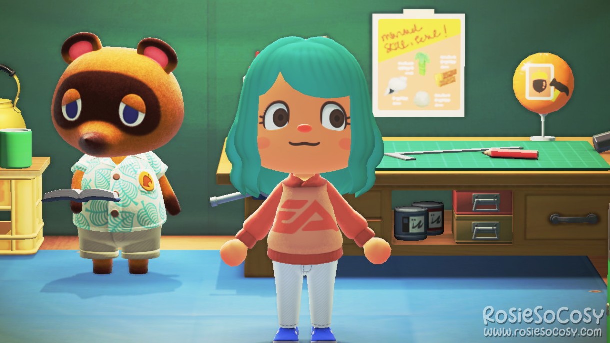 Rosie's character in Animal Crossing: New Horizons. Rosie has a medium skin tone, seafoam hair and brown eyes. She is wearing a custom design hoodie. It's a beige brown body with the EA logo in orange. The sleeves are the same colour orange. She is wearing white jeans and blue shoes. Rosie is standing in the Nook tent next to Tom Nook, who is reading a book.