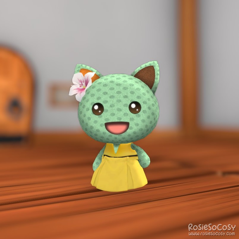 Rosie's character in Garden Paws is a minty green cat, with a dotted pattern all over, and an orange and brown ear. She is wearing a pink flower on her head, a yellow skirt and a yellow life jacket. The yellow items together look like a cute dress.